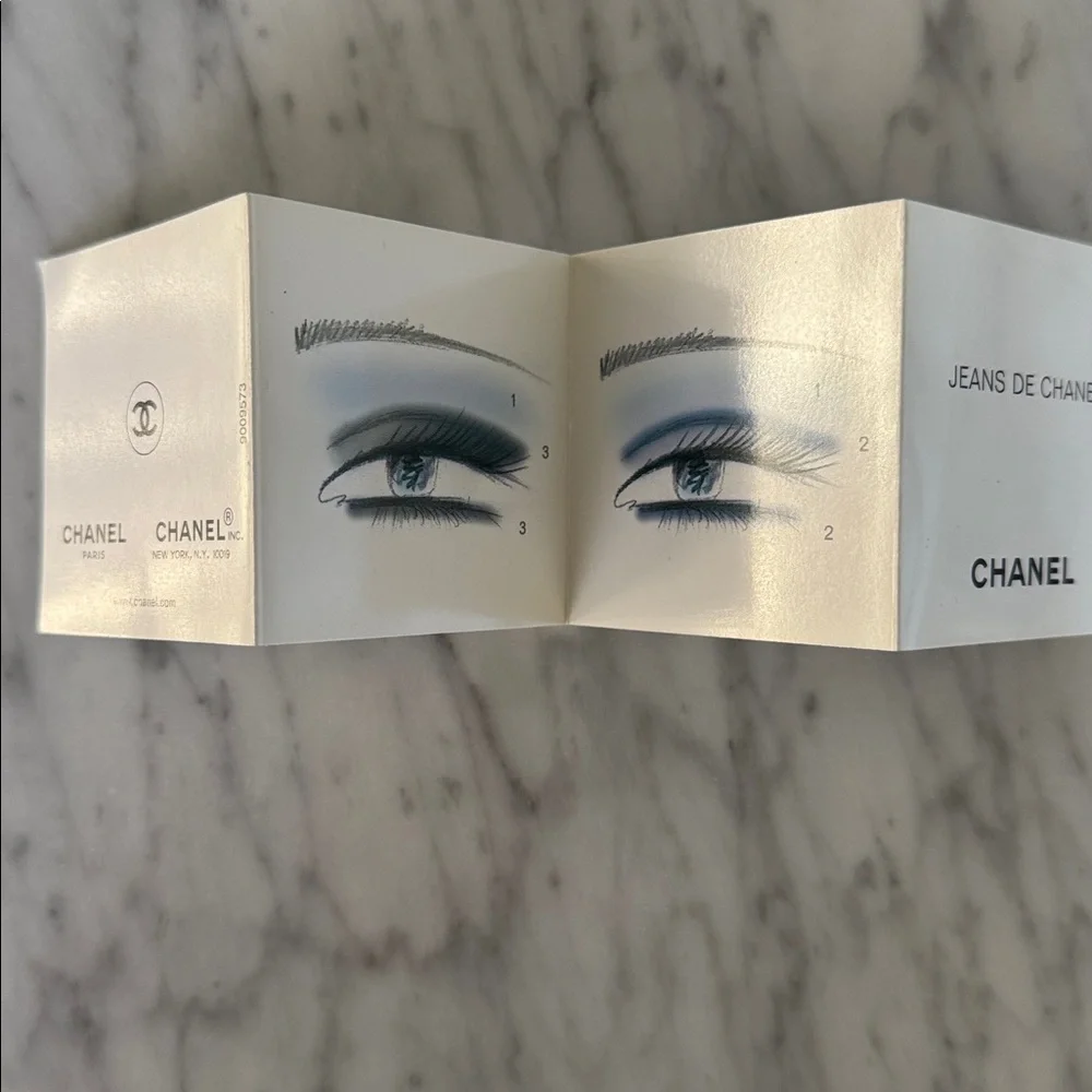 Chanel black logo matte paper gift bag + bonus eye makeup instruction booklet.